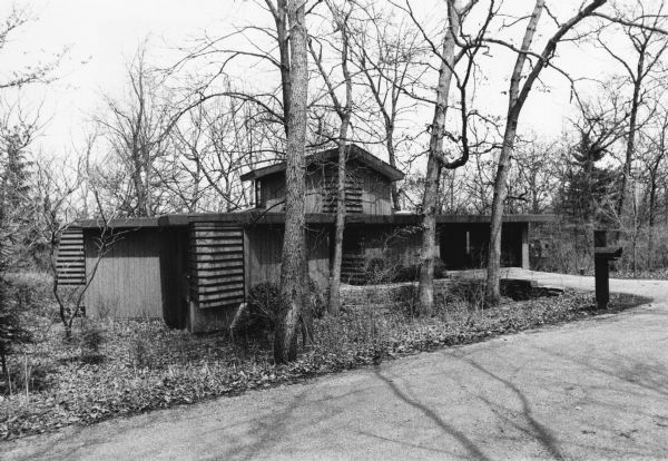 Exterior view of a prairie style house, which architecturally emphasizes the horizontal, at 2606 Marshall Parkway in the University of Wisconsin Arboretum.