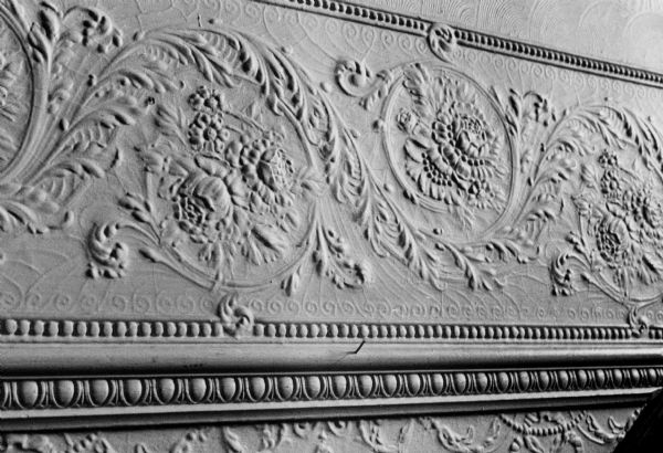 A pressed metal floral design in the Bethel Lutheran Church Parrish Shoppe at 315 North Carroll Street.  Also known as the Halle Steensland House.