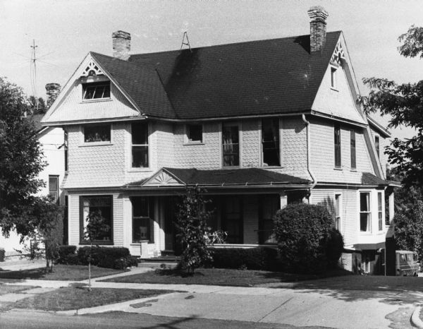 Notched shingles, a style that developed in the late 1800's, decorate the second story exterior of this house at 715 East Gorham Street.