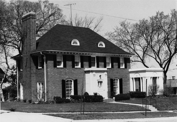 Exterior view of the Howard O. Moores house, 220 North Prospect Avenue in University Heights. It was commissioned by John M. Olin for his nephew in 1923. It was designed by Frank Riley in the Georgian revival style.