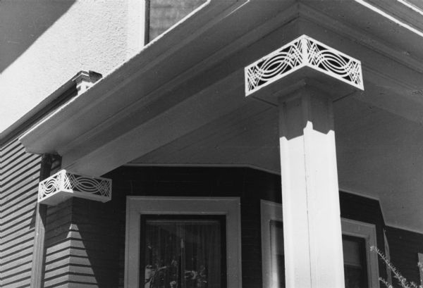 Decorative, unique column tops, or capitals, on columns supporting a porch on a house at 912-914 Jenifer Street, designed by architect Lew Porter.