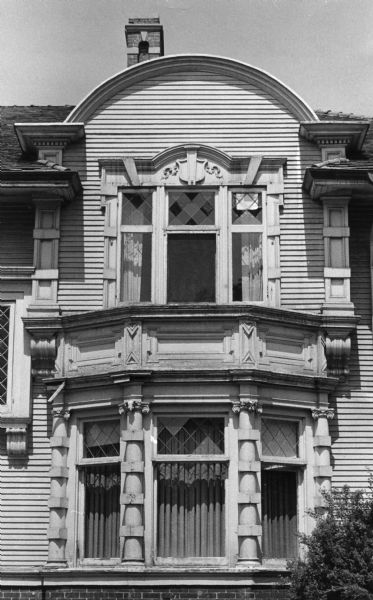 Ornate exterior of the Hanks house at 525 Wisconsin Avenue, built by Colonel William F. Vilas for his daughter Mary Vilas Hanks. The window detail shows vertical panels broken horizontally into elaborate "quoins," and the abundance of small details which the Claude and Starke building firm incorporated into the house.