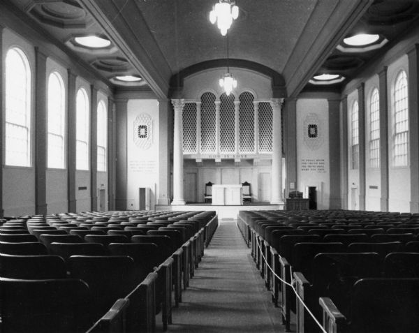 The interior of the First Church of Christ Scientist at 315 Wisconsin Avenue featuring Corinthian-style columns, Roman arches, and ornate capitols.