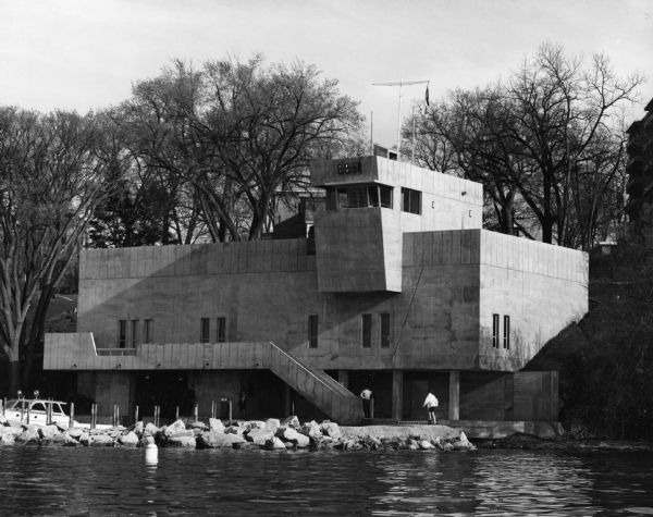 Exterior view of the University of Wisconsin-Madison lifesaving station, 144 East Gilman Street near James Madison Park. It was designed by Law, Law, Potter & Nystrom and built in 1967. It has a boathouse in its lower levels and an observation tower overlooking Lake Mendota.