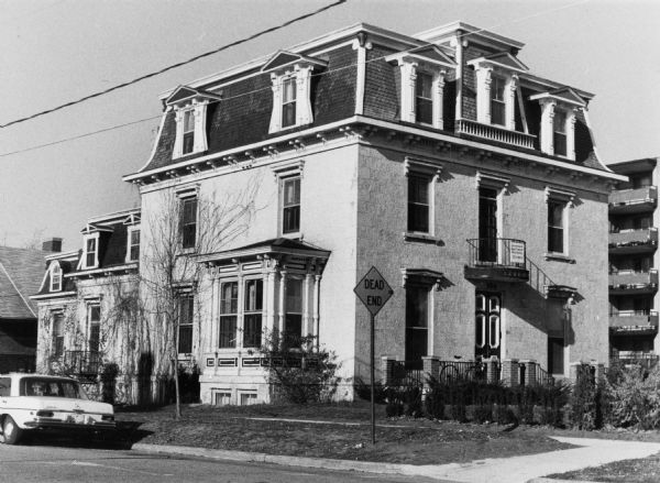 Exterior view of Madison landmark, The Kendall House, 104 East Gilman Street, which displays a combination of both Italian and French architectural styles, including a Mansard roof. The roof name comes from French architect Francois Mansart, who designed this style of roof to escape a tax on buildings with unoccupied attics.