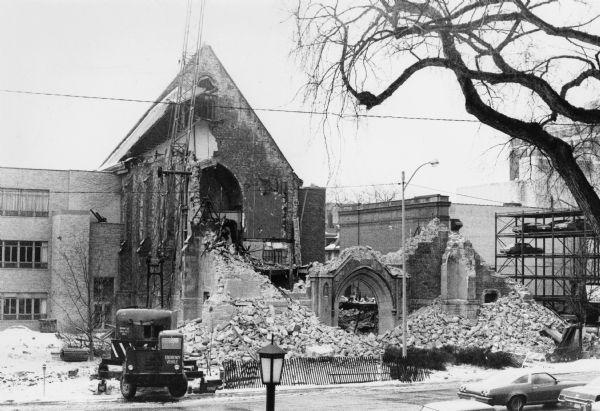 View of the 100-year-old First United Methodist Church (formerly the First Methodist Episcopal Church) in the process of being demolished. It stood at the corner of E. Dayton and 203 Wisconsin Avenue, which is now a garden area.