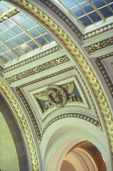 Skylight in the Wisconsin State Capitol, over the main stairs to the second floor. The figure in the center is an eagle in a wreath, which is an allegory of the Republic.