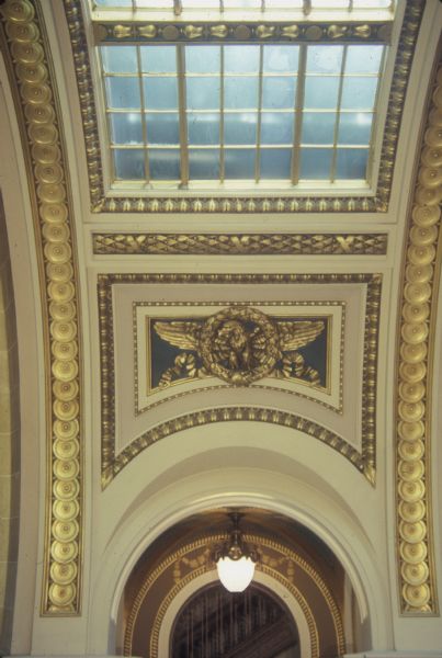 Skylight over stairs in the Wisconsin State Capitol. The eagle of the Republic is visible below the skylight.