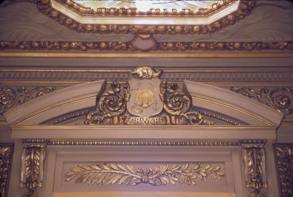 Decoration over entrance to Governor's Conference Room in the Wisconsin State Capitol before restoration.