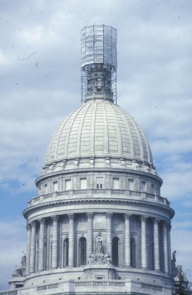 Scaffolding enclosure around "Wisconsin" statue, at the Wisconsin State Capitol, during 1990 restoration and regilding of the sculpture.
