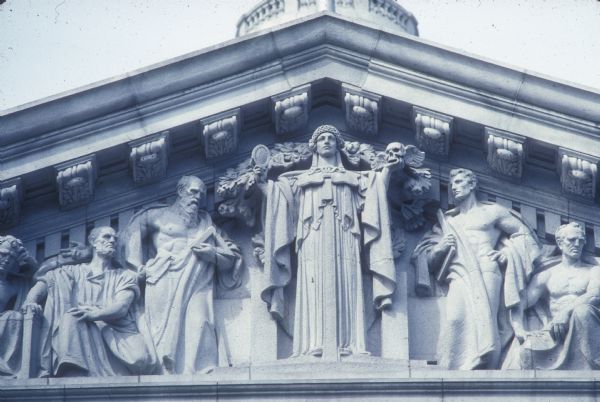 Detail of the sculpture "The Virtues and Traits of Character," by Adolph A. Weinman, on the South Pediment of the Wisconsin State Capitol.