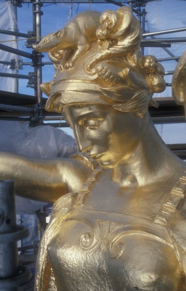 "Wisconsin" statue on top of the dome of the Wisconsin State Capitol during regilding in 1990.