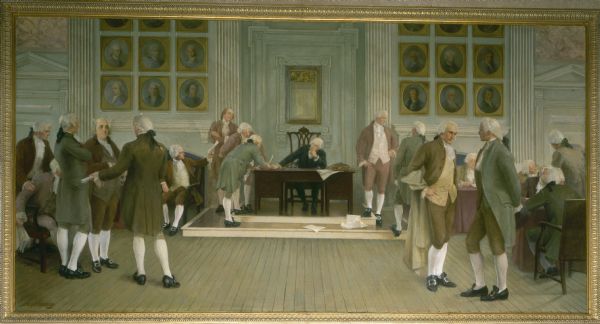 Painting, in the Wisconsin State Capitol, of "The Signing of the American Constitution," one of four mural paintings by Albert Herter on the west wall of the Supreme Court. The scene represents American law, and depicts the signing of the Constitution of the United States of America in 1787 in Philadelphia, Pennsylvania, with George Washington presiding over the occasion. Washington is in the chair behind the table on a low dais. To the right foreground are James Madison, with a cloak on his arm and Alexander Hamilton, standing. Farther back near Washington is Thomas Jefferson talking to another delegate whose back is turned. In the group of four men standing to the left in the foreground is Benjamin Franklin.