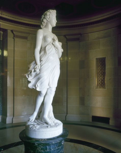 "The West" statue at the first floor southwest entrance the Wisconsin State Capitol. Vinnie Ream Hoxie modeled this statue in 1866-1868. It was carved in Rome and exhibited at the 1893 Columbian Exposition in Chicago. Her gowns were blown by the prairie winds.