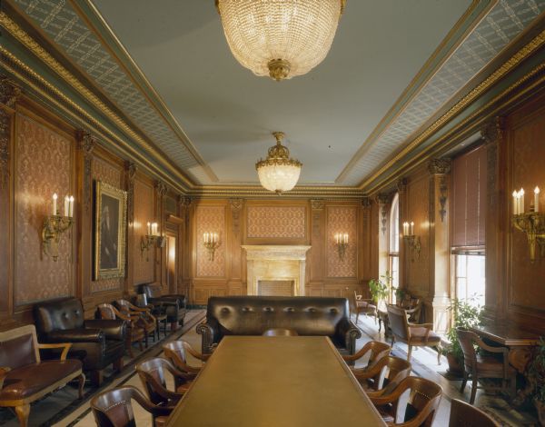 Assembly Parlor, in the Wisconsin State Capitol, off of the Assembly floor, is used for caucus meetings. It is trimmed in Circassian walnut paneling with mantels of Sienna yellow marble and a marble tile floor.