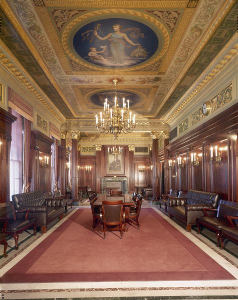 Senate Parlor, in the Wisconsin State Capitol, with walls of mahogany, a mural painting on the ceiling, and mantels and plinth of Greek marble.