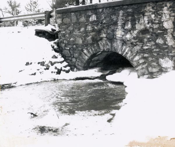 Stone bridge over Two Mile Creek in Wood County.  The creek is not frozen although the ground is snow-covered.