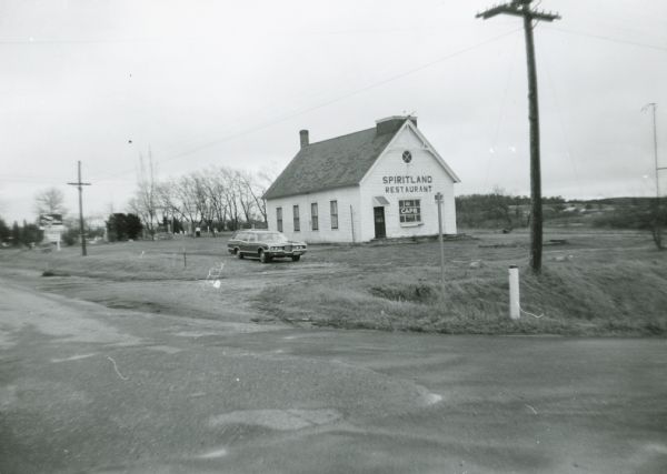 Spiritland Cafe, a restaurant located in a former church, with the cemetery in the background.  The restaurant was located on CTH D in Portage County.