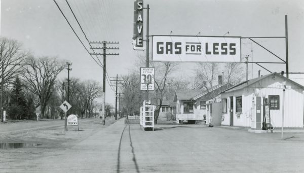 A gasoline station along US Highway 51 in Whiting, Portage County, attracted passing motorists with an attention-getting "gas for less" sign.