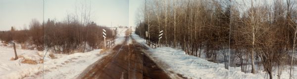 A wintertime panoramic view of the bridge on Rainbow Drive, a local road in the Town of Halsey, Marathon County, looking east.