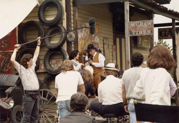 A scene during the filming of "Dillinger," a biographical made-for-TV movie, many portions of which were shot in Wisconsin.  Here actor Mark Harmon makes a telephone call at one of the historic buildings at Old World Wisconsin in Eagle that has been transformed into a Depression-era country store.