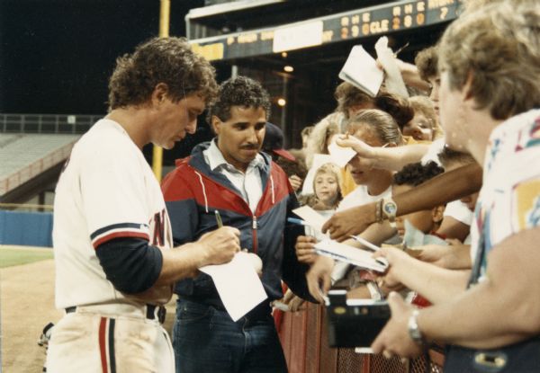 Actor Tom Berenger who starred in the film "Major League," signing autographs at County Stadium, where some scenes for the movie were filmed.