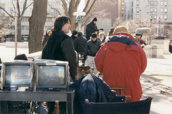 Actor Keanu Reeves during a pause in the filming of the motion picture "Chain Reaction" on the capitol grounds. In the film, the Wisconsin State Capitol was used to represent the Capitol in Washington, D.C.