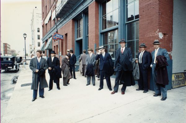 Costumed actors on location in Milwaukee during the filming of the made-for-TV movie, Dillinger.  Here, Milwaukee's historic Third Ward was being used to represent Depression-era Chicago.