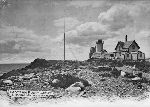 Eastern Point Lighthouse at "Mother Ann" and residence on rocky point, Gloucester, Massachusetts. Mother Ann is a rocky cliff at the far south end of Eastern Point, near the lighthouse.  Published by the Albertype Company of Brooklyn, New York. Text on photograph reads: "Eastern Point Light. Showing Mother Ann." and "The Albertype Co. Brooklyn, N.Y."