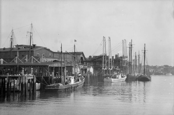 View of a pier and docks with fishing boats in Gloucester, Massachusetts.