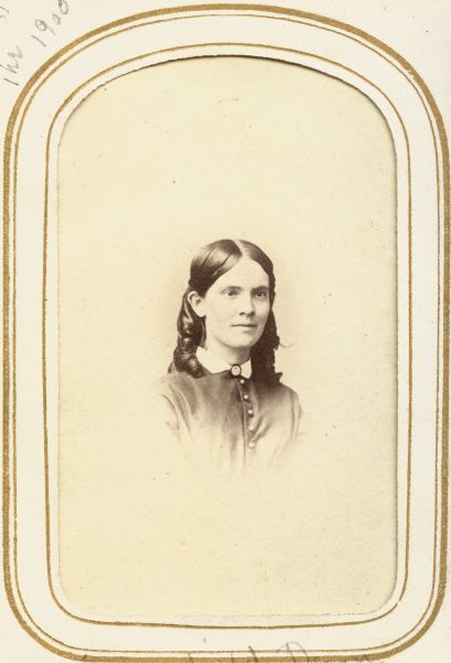Vignetted carte-de-visite portrait of Sarah Fairchild Dean Conover, the daughter of Jairus Fairchild and the sister of Governor Lucius Fairchild.  Sarah married and later divorced Madison businessman Eliab Dean; she later married University of Wisconsin professor Obadiah Conover.  This photograph was probably taken in 1865-1866, the brief period when photographer J. Bodtker was active in Madison.  Mrs. Conover's step daughter-in-law Grace Clark Conover dated it as a few years years earlier: "[taken] in the '50s as a young woman; she looked the same till she died in the 1900s."