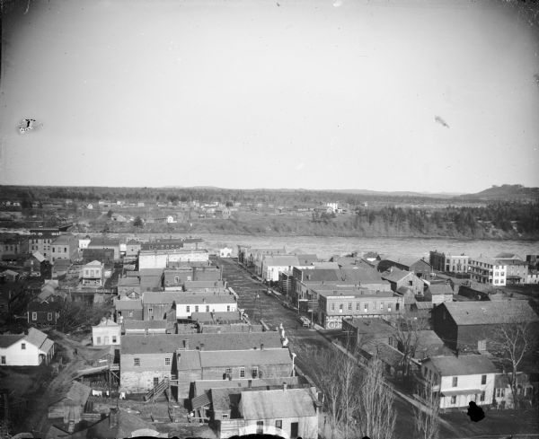 Elevated view of the river and town. Probably prior to 1885 because the Van Schaick building/photograph gallery is not constructed on Second Street.