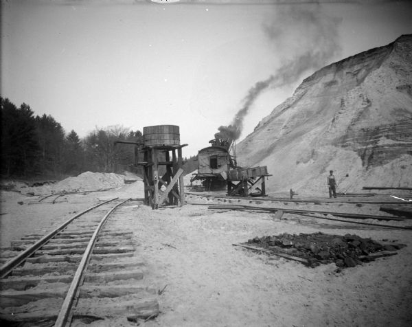 Sand quarrying in German Hill to obtain fill for use in the business district after a flood. Steam shovel in use.