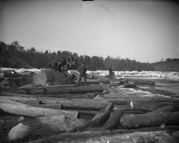 Five men and a log jam on an icy river.