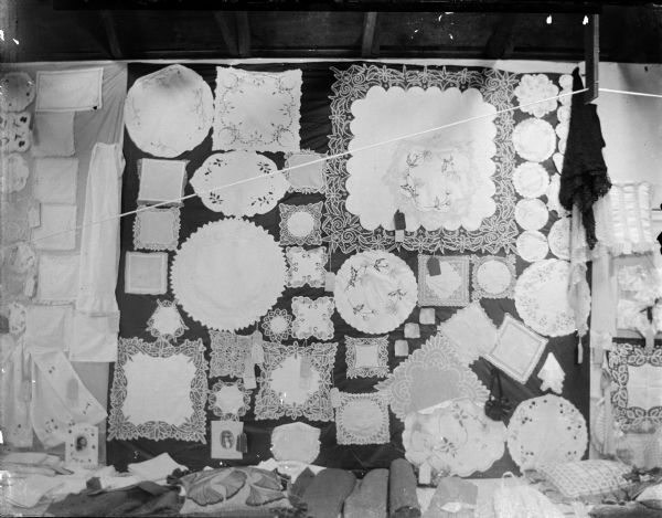 Display of doilies for sale in a store window.