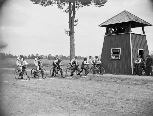 Six cyclists at the starting line for a race at the Jackson County Fairgrounds.