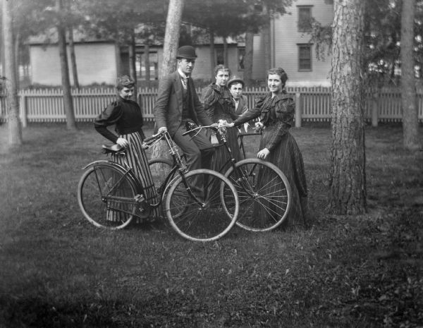 Sidney Catle, on bike, stands with his sister Sarah to his right, Harvey Richards, and twin sisters.
