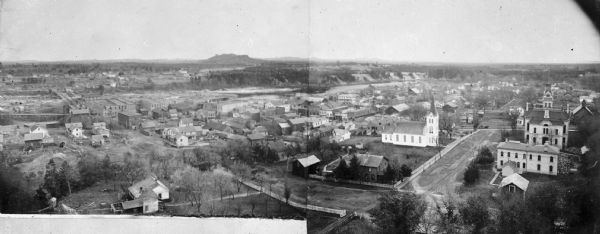 An elevated, panoramic view of the town, composed of two photographs and probably taken from the Third Street School.