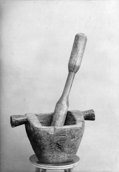 View of a mortar and pestle on a stool.