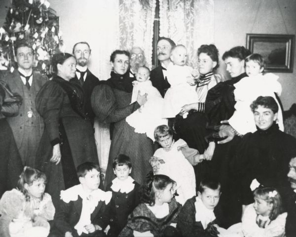 Christmas gathering at the home of George L. Storer.

Top row, left to right:  Fannie and George Storer, Mary Johnson Storer, John Storer, Myra Storer holding baby Jack Storer, George L. Storer, Larry Conover, Isabelle Storer Conover holding baby Harvey Conover, Annie Storer Brown holding baby Eleanore Brown, Mary Brown, Mary Storer Frankenburger.

Lower row, left to right: Margaret Frankenburger, George Storer Jr., Timothy Brown III, Polly Conover, Porter Storer, Dorothy Frankenburger, David B. Frankenburger.