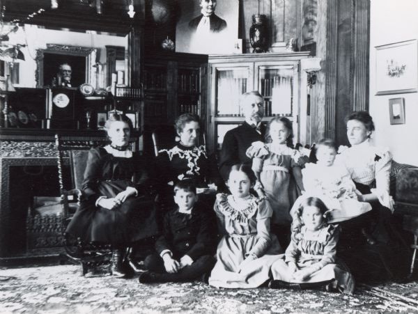 Members of the Brown family and friends taken in the Fred and Annie Brown house, 121 East Gilman Street.