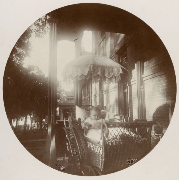 Alice Brown on the porch of 121 East Gilman Street. Taken with a Kodak #2 camera.