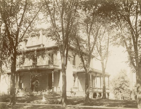 Built as the John E, Kendall house in 1855. It was the George and Mary Storer house, 104 East Gilman Street, when this photograph was taken.