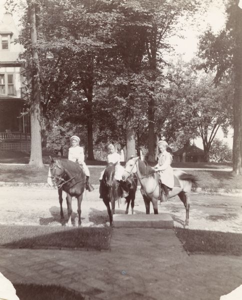 From left to right: Eleanor Brown, Catherine Brandenburg and Mary Brown in front of 121 East Gilman Stret.
