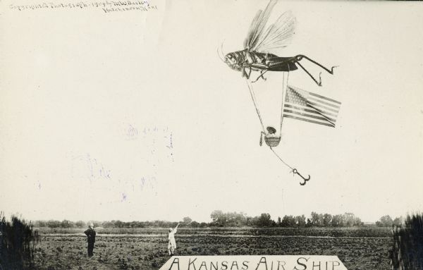Photomontage of a giant grasshopper lifting an anchored basket with a baby girl inside.  The rope tethered to the basket has a large American flag attached to it; the baby girl also holds an American flag in her hand.  On the field below, a man and a girl are looking up and pointing at the basket.  Text at the bottom says, "A Kansas Air Ship."