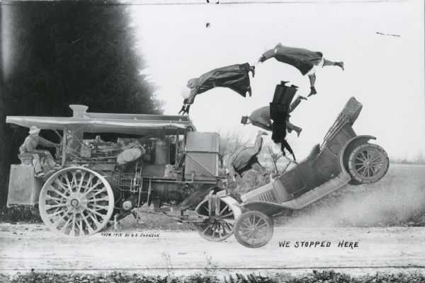 Photomontage of a group of travellers in a car colliding with a steamroller.  The travellers have been thrown out of their car and into the air.  The words, "We stopped here," are inscribed in the lower right corner of the image field.