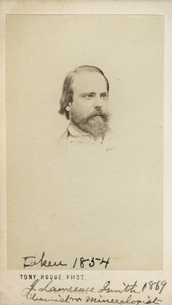 Carte-de-visite portrait of John Lawrence Smith (1818-1883), American chemist.  From 1846-1850, he worked for the Turkish government, exploring their country's mineral resources, wherein he discovered deposits of coal, chrome ore, and the famous emery deposits of Naxos.  During his lifetime, his collection of meteorites was the greatest in the United States. The bottom of the image bears the handwritten inscriptions, "Taken 1854" and, "J. Lawrence Smith, 1869.  Chemist and Minerologist."
