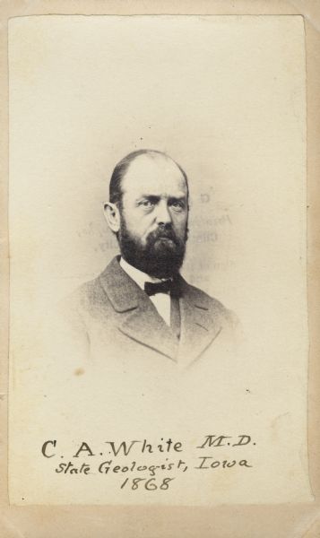 Carte-de-visite portrait of Charles A. White (1826-1910), an American geologist and paleontologist. White was the State geologist of Iowa in 1866-70, and a professor of natural history at the State University of Iowa from 1867-73. He was the geologist and paleontologist for the United States Geological Survey between 1874 and 1892. The bottom of the image bears the handwritten text: "C.A. White M.D., State Geologist, Iowa, 1868."