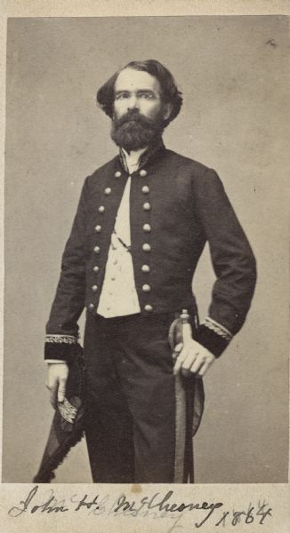 Carte-de-visite portrait of Professor Joseph H. McChesney, a geologist and paleontologist associated with the Illinois State Geological Survey. Shown here in three-quarter profile, wearing court dress of the diplomatic corps. The handwritten inscription at the bottom reads, "John H. McChesney, 1864. Geologist-Consulate-Newcastle on Tyne".