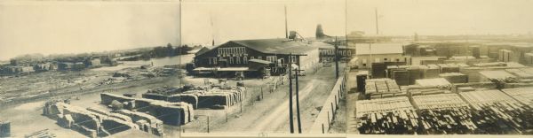 Triptych panoramic view of Marinette lumber district, with M & M Box Company factory in the center.